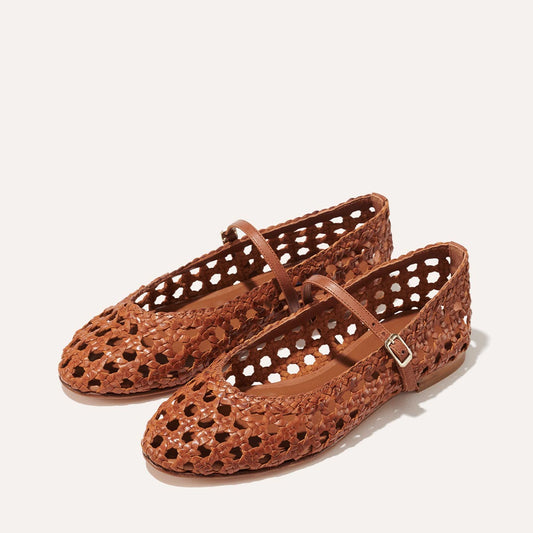 Margaux's classic and comfortable mary jane ballet flat, handwoven in India from soft saddle brown leather and finished in Spain