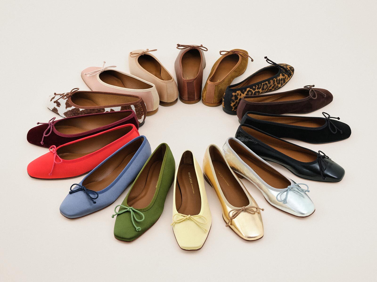 Colorful flats arranged in a circular pattern on a light background