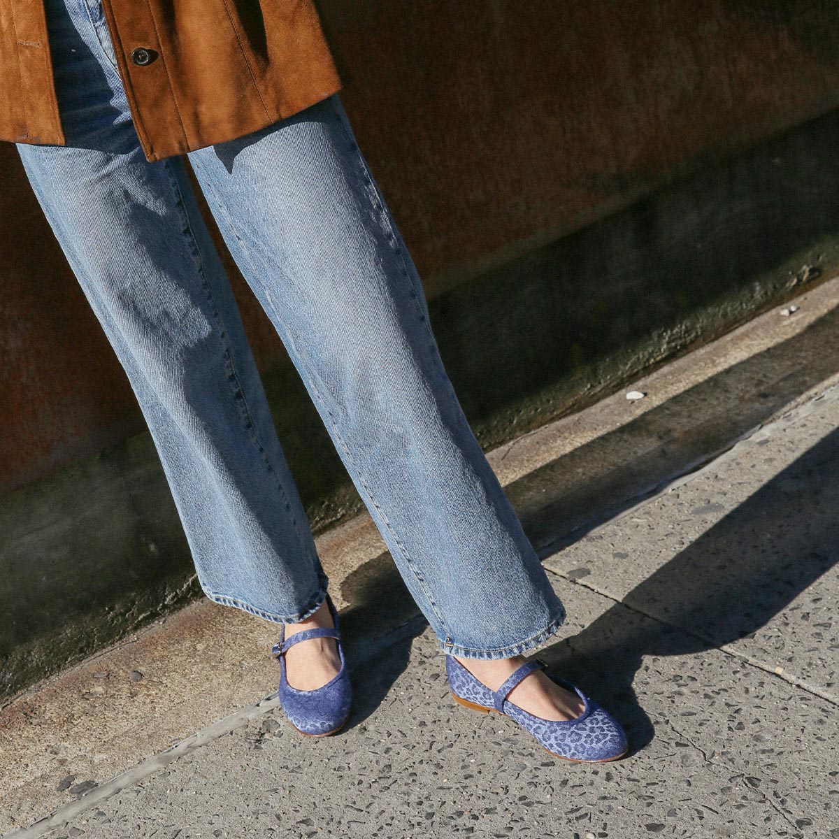 The Demi Jane in blue Leopard Denim, a ballet flat with a rounded toe and an adjustable strap for a secure fit.