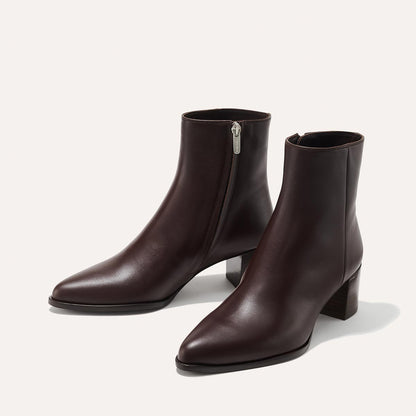 The Downtown Boot in Espresso Calf, a chic ankle-height design complete with a Western-inspired welt and a comfortable 2.5-inch stacked heel.