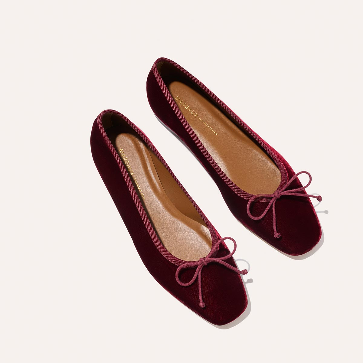 The Fonteyn - Burgundy Velvet by Margaux: handcrafted modern ballet flats with square toes and matching bows, shown on a light background.