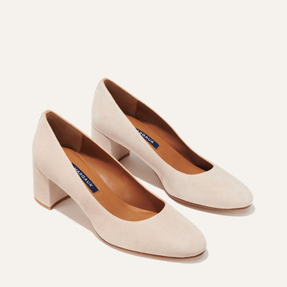 The Heel in Fawn Suede, a classic block heel featuring a sleek almond toe design complemented by a comfortable 2.5-inch heel.