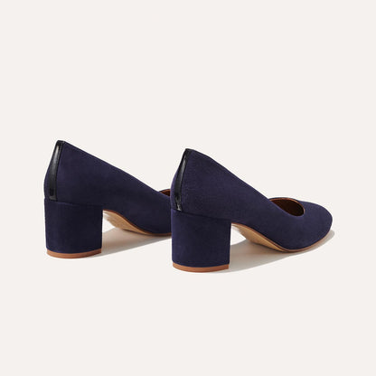 The Heel in Midnight Suede, a classic block heel featuring a sleek almond toe design complemented by a comfortable 2.5-inch heel.