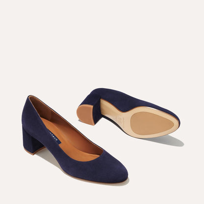 The Heel in Midnight Suede, a classic block heel featuring a sleek almond toe design complemented by a comfortable 2.5-inch heel.