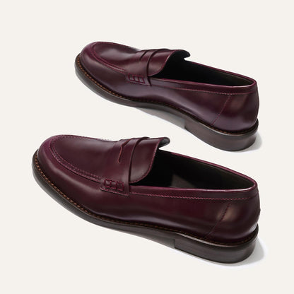The Marlowe Loafer - Burgundy Calf by margaux-development: classic penny slot burgundy leather loafers with brown soles and visible stitching, shown on a neutral background.