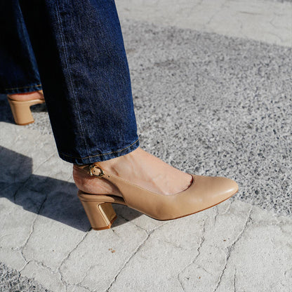 The Cluny Slingback in Dune Nappa, featuring a sleek Italian nappa leather upper with an adjustable buckle and a comfortable 2.5-inch black heel.