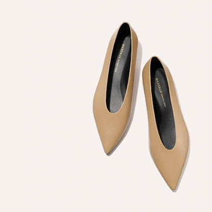 The Parra - Praline Nappa by margaux-development are tan shoes with a structured silhouette and high vamp.