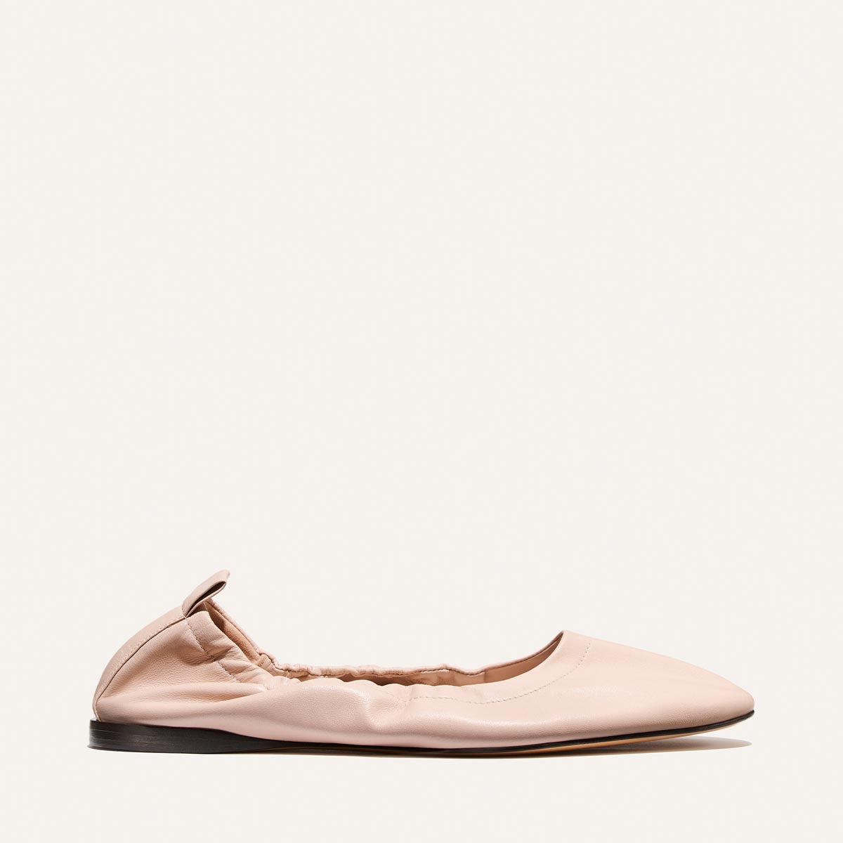 Pink flat shoe on a white background