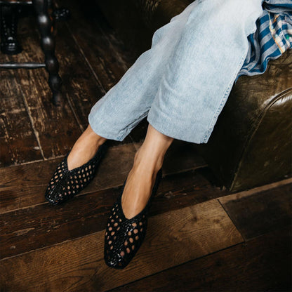 The Woven Paz in Black, featuring a handwoven Italian nappa leather upper with a flattering tapered toe and high vamp.