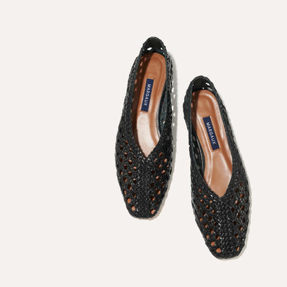 The Woven Paz in Black, featuring a handwoven Italian nappa leather upper with a flattering tapered toe and high vamp.