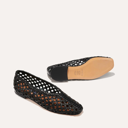 The Woven Paz in Black, featuring a handwoven Italian nappa leather upper with a flattering tapered toe and high vamp.