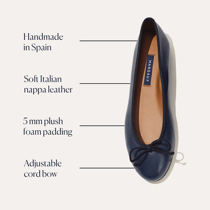 The Demi by margaux-development is a handmade ballet flat in black and navy nappa leather from Italy, with 5 mm plush foam padding and an adjustable cord bow for a classic look.