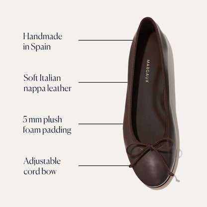 The Demi - Espresso Nappa by margaux-development is a popular ballet flat, handmade in Spain from soft Italian nappa leather. It features 5 mm plush foam padding, an adjustable cord bow, and comes in brown, shown here from above.