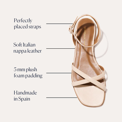 The Flat Sandal - Magnolia Nappa by Margaux features perfectly placed straps, soft Italian nappa leather, a foam-cushioned insole with 5 mm padding, and is handmade in Spain.
