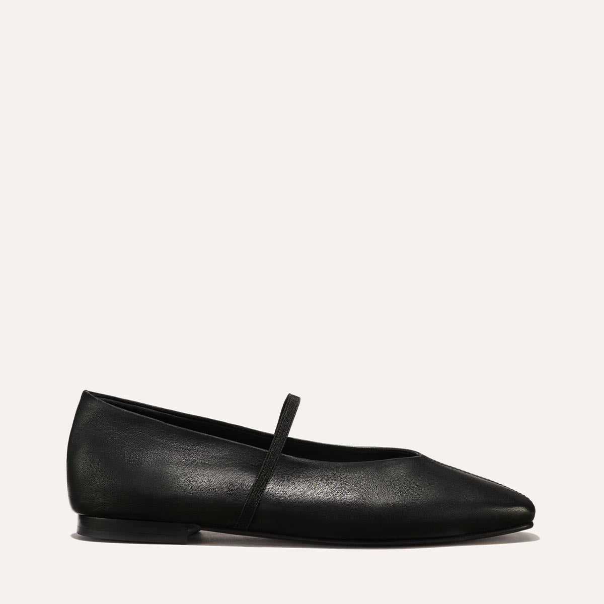 The Phoebe in smooth Black Nappa leather, a ballet flat with a squared off toe, high vamp and elastic Mary Jane strap.