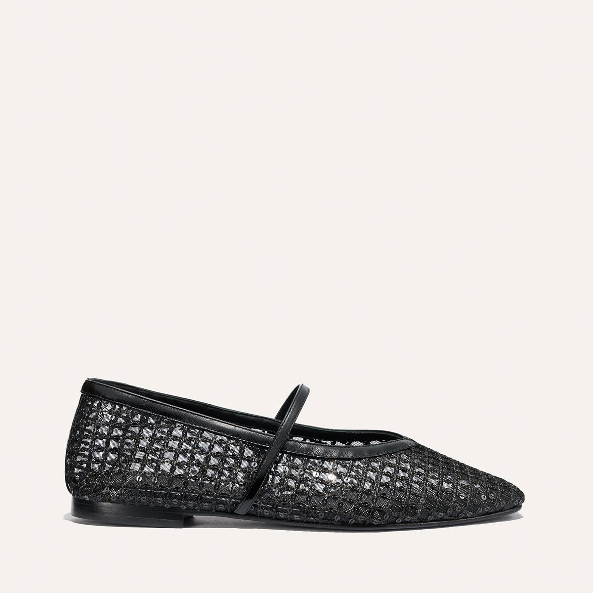 The Phoebe - Black Sequin Mesh by margaux-development: a black mesh flat with a subtle grid pattern, pointed toe, thin black sole, single thin strap, and sacchetto construction. Shown on a light, plain background.