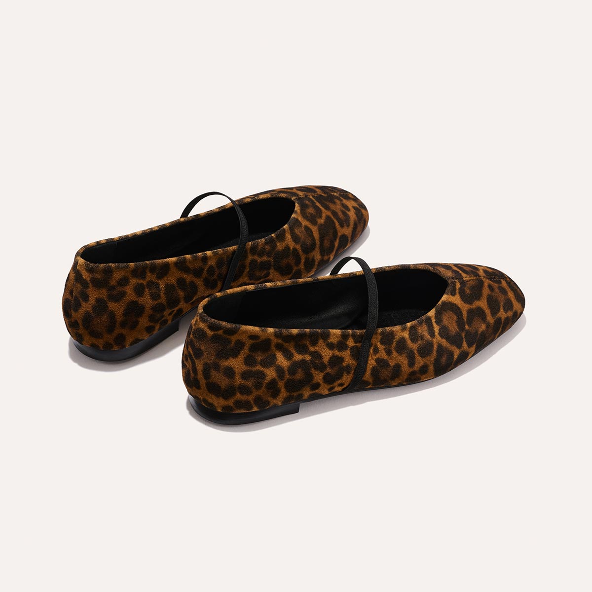 The Phoebe in luxe Leopard Suede, a ballet flat with a squared off toe, high vamp and elastic Mary Jane strap.