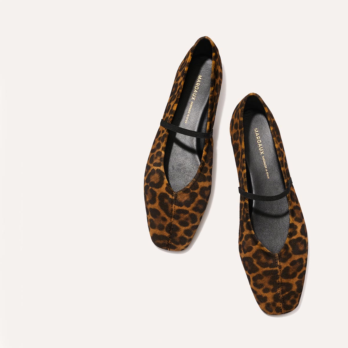 The Phoebe in luxe Leopard Suede, a ballet flat with a squared off toe, high vamp and elastic Mary Jane strap.