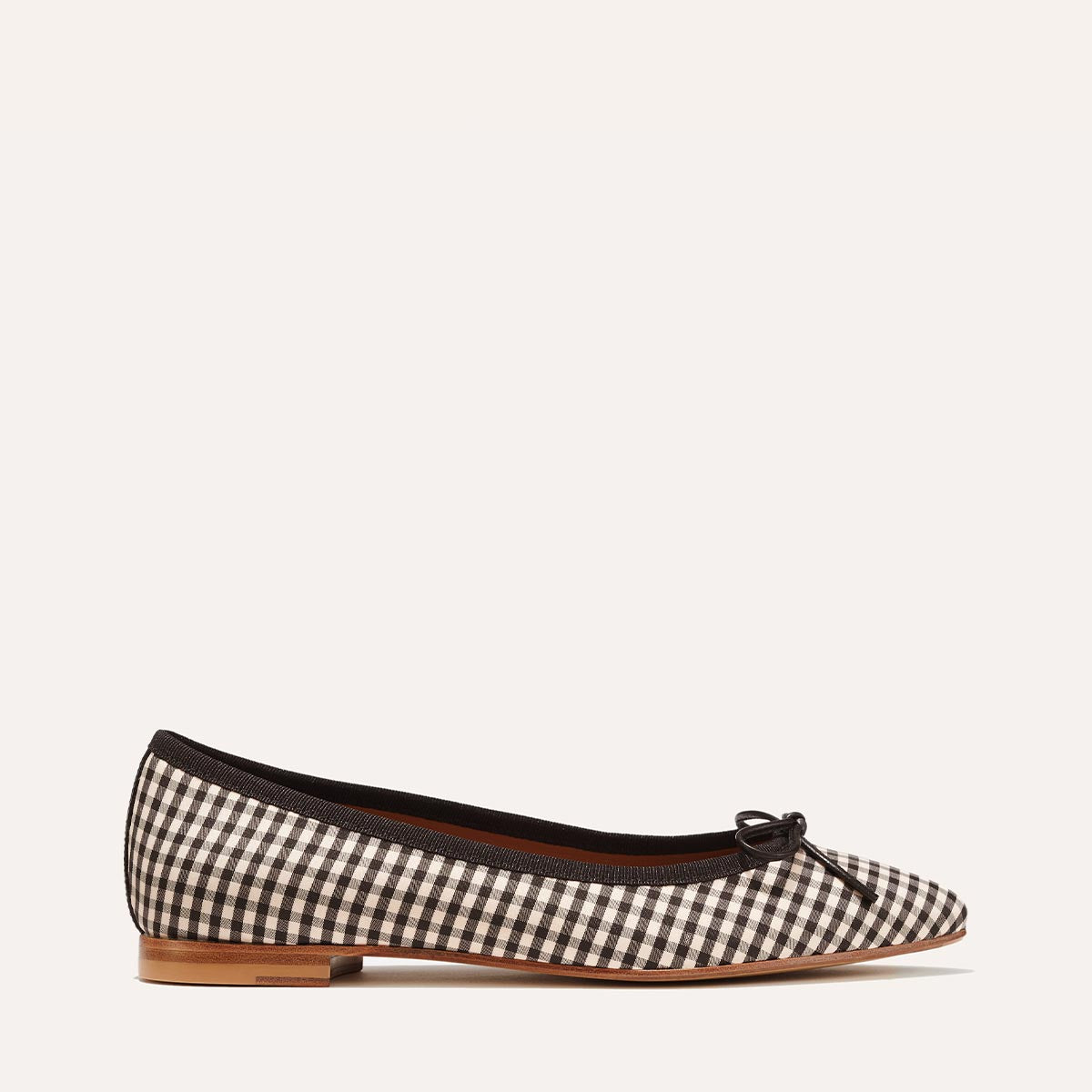 Margaux's classic and comfortable Pointe ballet flat in tan and black gingham-printed fabric with an elegant pointed toe