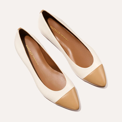The Pointe - Ivory and Toffee Nappa by Margaux: women’s flats with cream sides, tan pointed toe caps, brown insoles, and gold Margaux branding—perfect for refining any look.