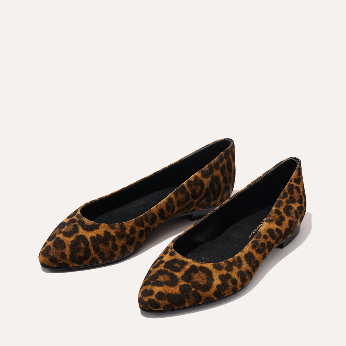 The Pointe in leopard printed suede, a classic and comfortable ballet flat featuring a refined pointed toe design.