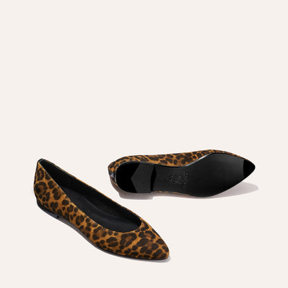 The Pointe - Leopard Suede by Margaux: womens pointed-toe ballet flats in brown and black leopard print. Inspired by Marie Claire, one shoe shows the top and side; the other reveals the black sole.