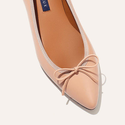 The Pointe in Rose Nappa, a classic and comfortable ballet flat featuring a refined pointed toe design and decorative bow. 