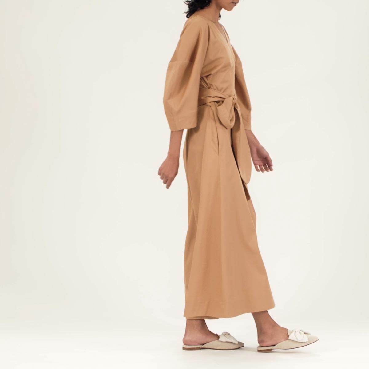 The Mule in Linen shown on model styled with a tan long sleeve midi dress with a tied belt.