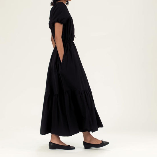 The Pointe in Black Nappa shown on model styled with a black short sleeve maxi dress.