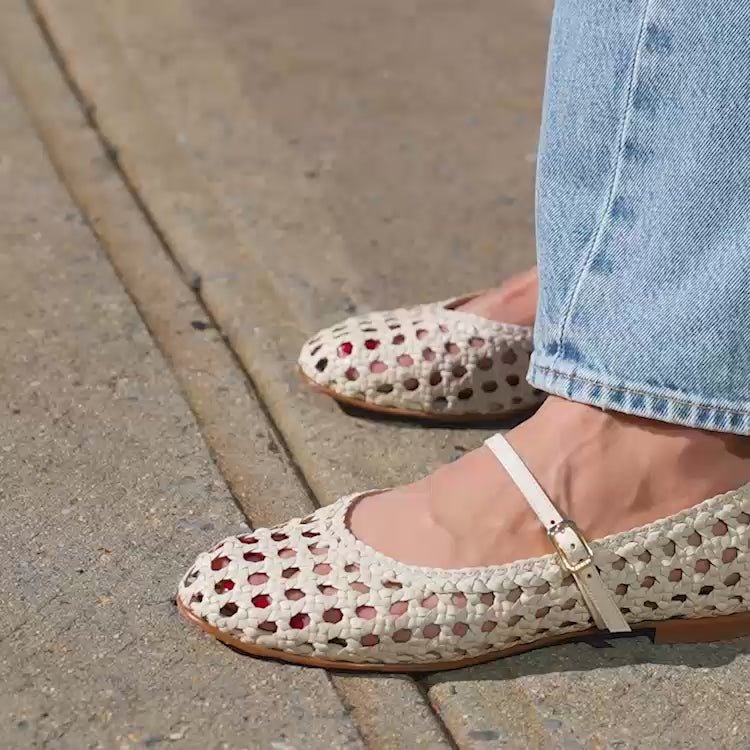 A ecru woven Mary Jane flat made from handwoven leather with a classic strap.