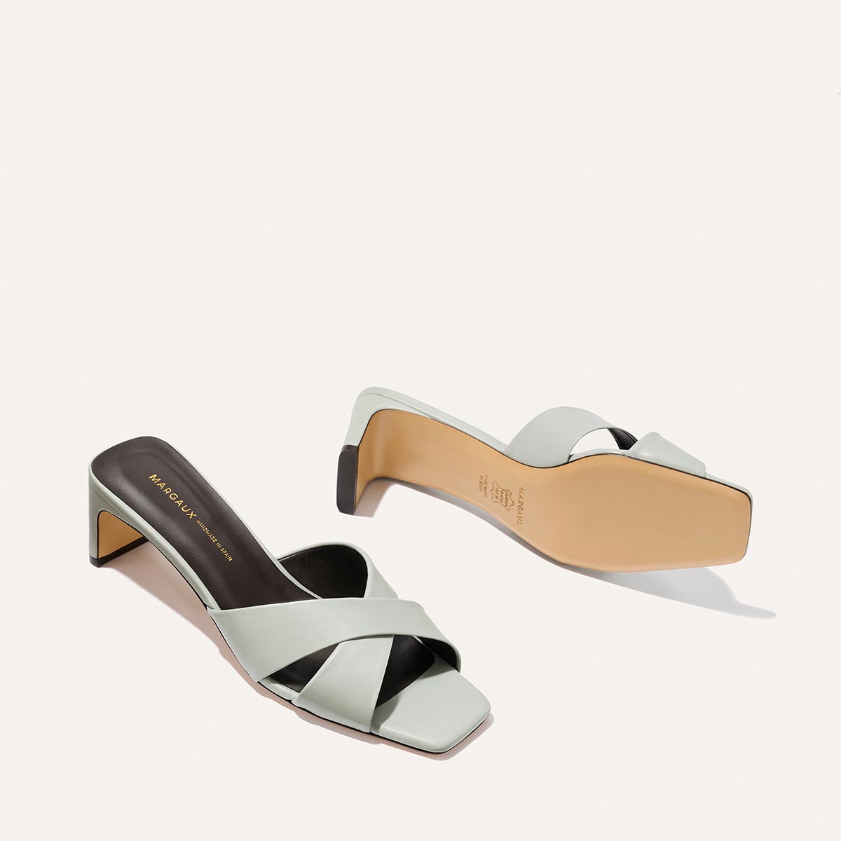 Margaux The Selene 50 - Sky Nappa light blue leather slide sandals with a low block heel, crossed straps, and a padded insole.