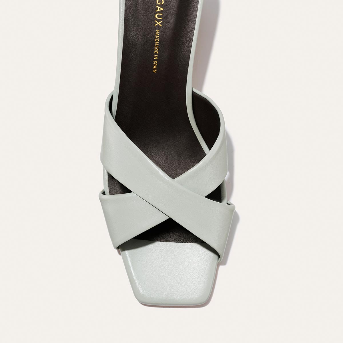 Margaux The Selene 50 - Sky Nappa light blue slip-on heeled sandal with wide, crisscrossed straps, a block heel, and a square toe.