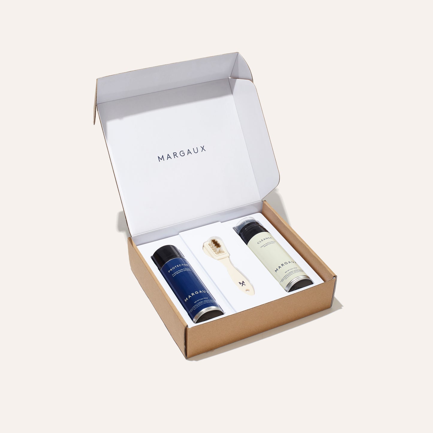 Suede care kit by Margaux with a suede brush, cleaning spray, and protectant