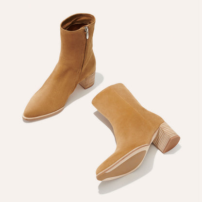 The Downtown Boot in Sahara Suede, a chic ankle-height design complete with a Western-inspired welt and a comfortable 2.5-inch stacked heel.
