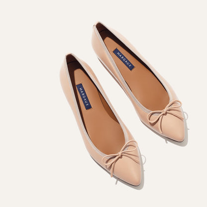 The Pointe in Rose Nappa, a classic and comfortable ballet flat featuring a refined pointed toe design and decorative bow. 