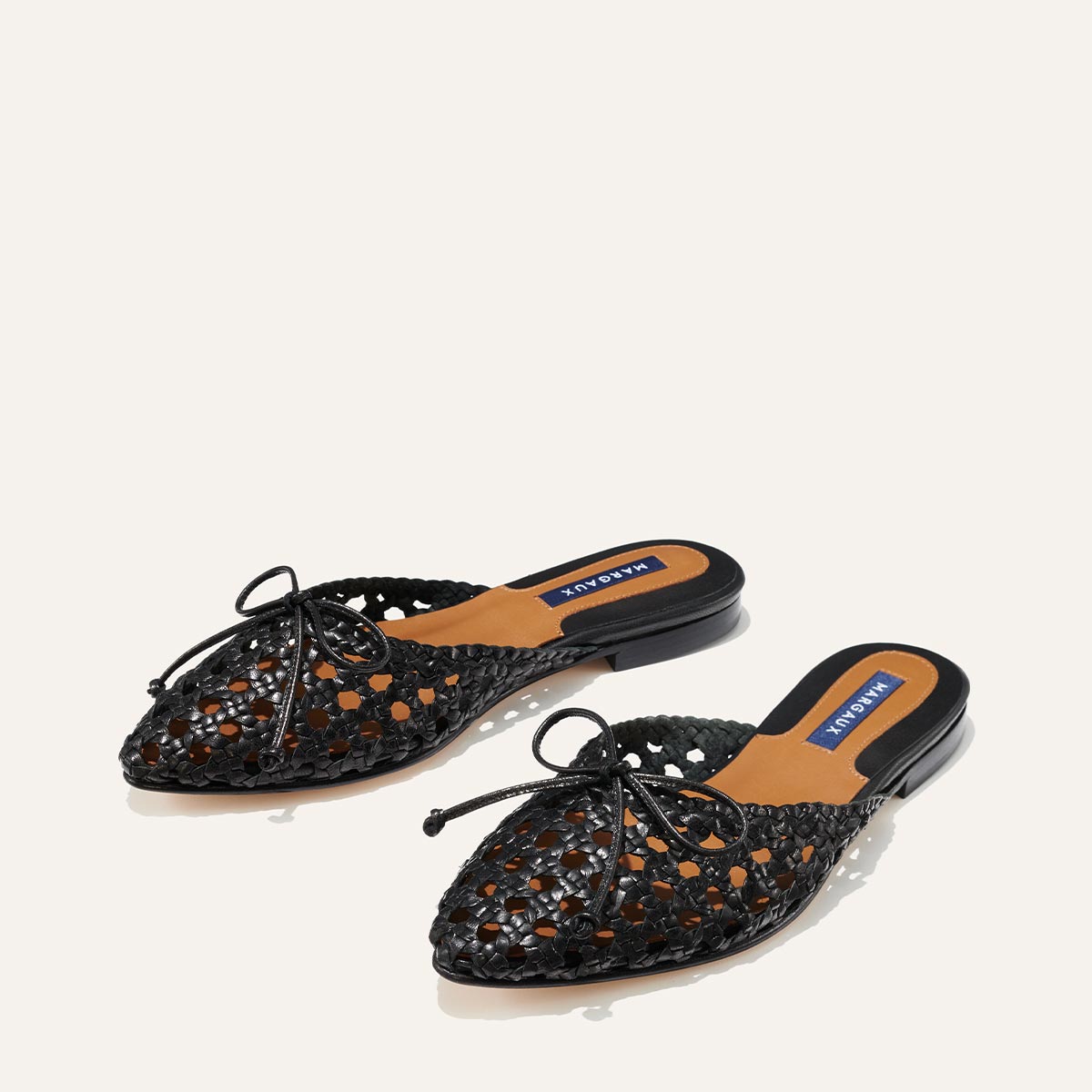 Margaux's classic and comfortable Ballet Mule, handwoven in India from soft black leather and finished in Spain