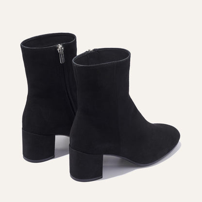 The Boot in Black Suede, featuring an elegant almond toe and block heel, crafted from high-quality Italian leather for a timeless and modern look.