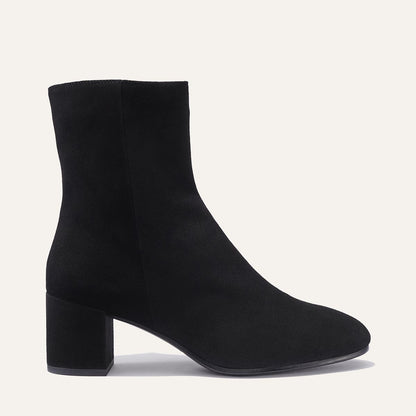 The Boot in Black Suede, featuring an elegant almond toe and block heel, crafted from high-quality Italian leather for a timeless and modern look.