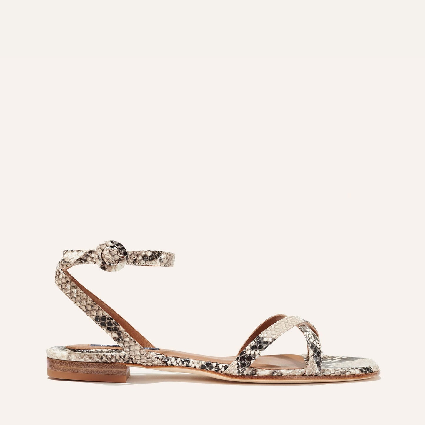 Margaux's classic and comfortable Flat Sandal, made in Spain from python-embossed Italian leather