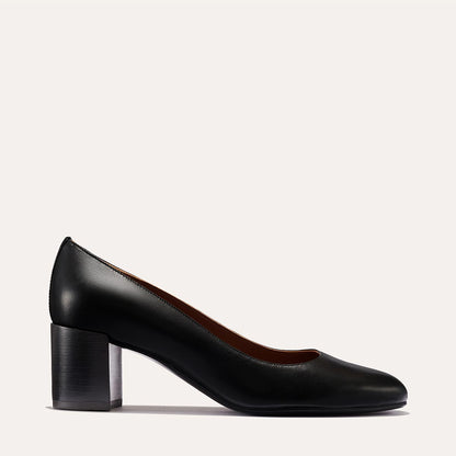 The Heel in Black Nappa, a classic block heel featuring a sleek almond toe design complemented by a comfortable 2.5-inch heel.