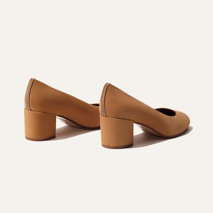 The Heel - Cacao Suede by Margaux: elegant tan suede shoes with a comfortable block heel, displayed from the back and side on a plain off-white background.