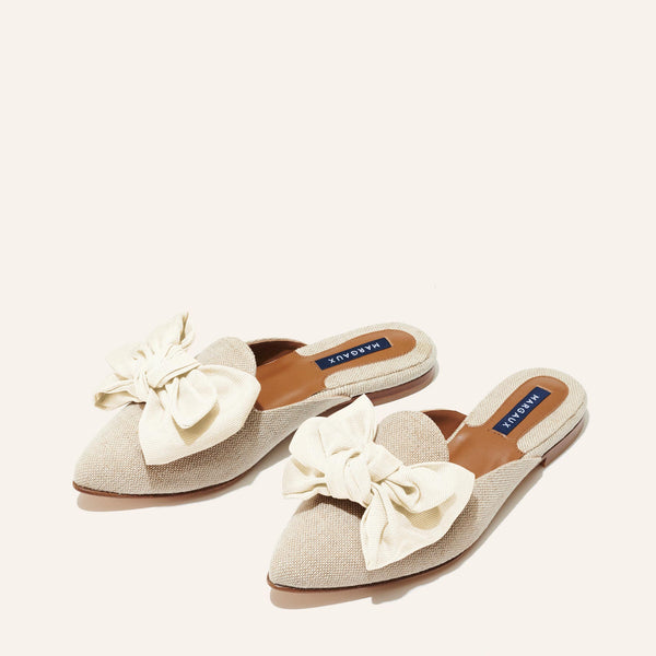 Margaux's classic and comfortable Mule, made in Spain from linen and finished with an ivory grosgrain bow