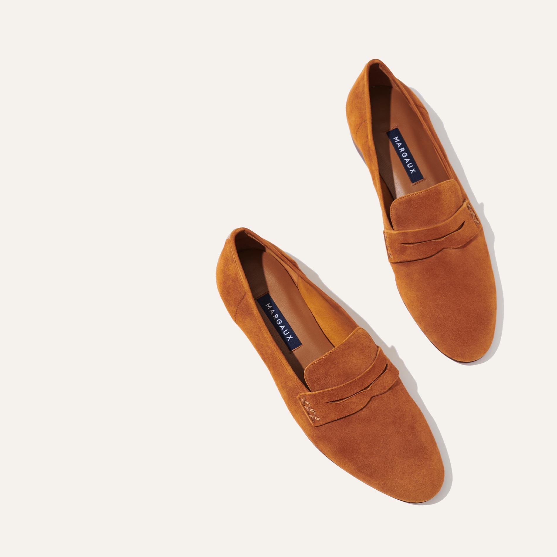 Margaux's classic and comfortable Penny loafer, made in Spain from soft, black Italian suede 