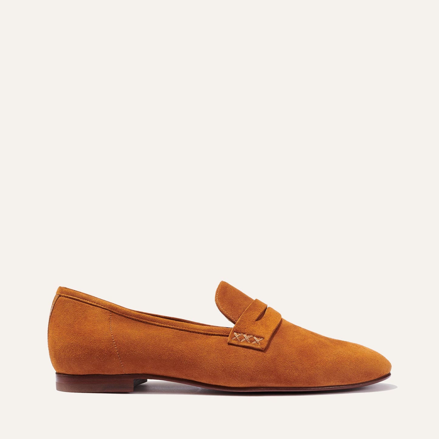 Margaux's classic and comfortable Penny loafer, made in a soft, caramel brown Italian suede