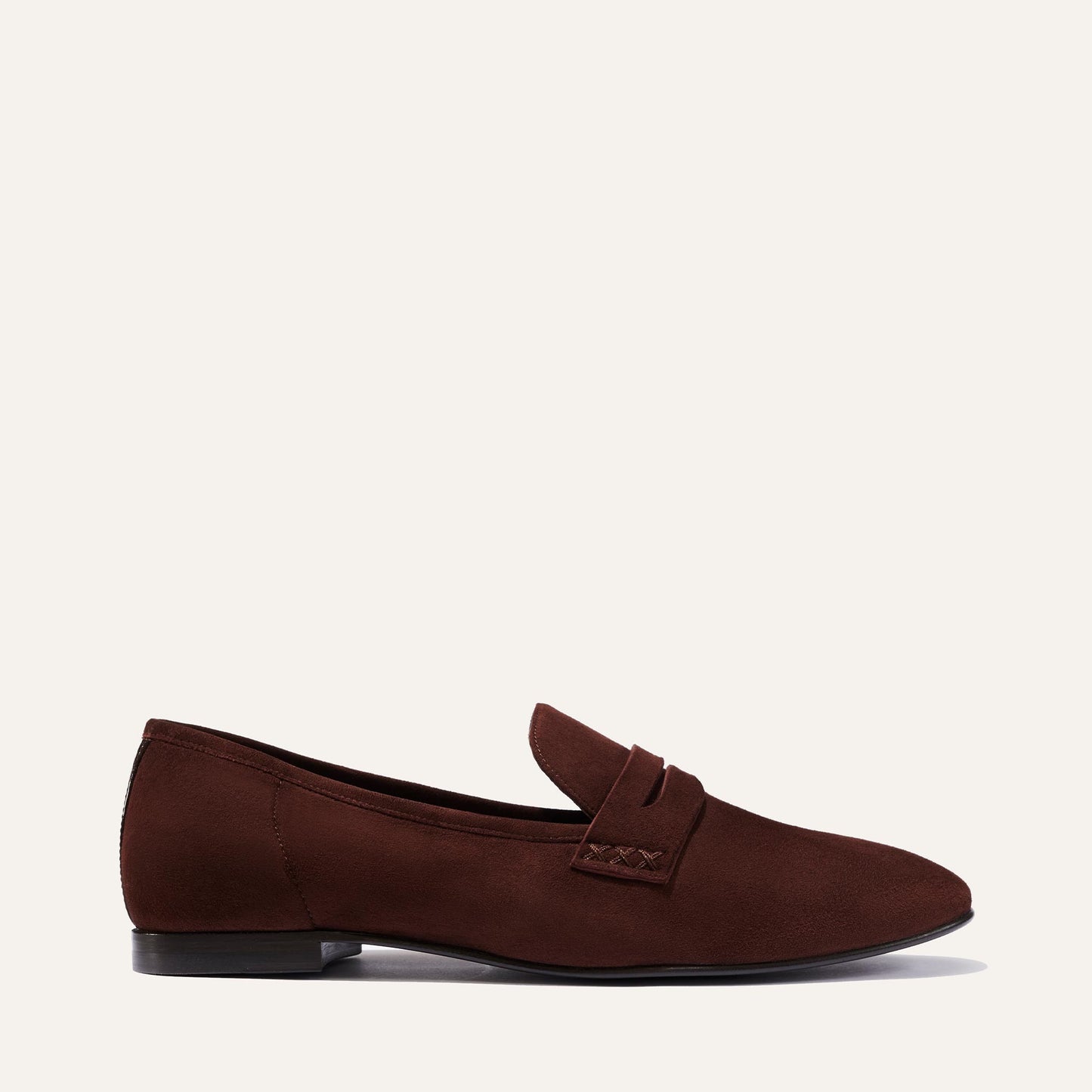 Margaux's classic and comfortable Penny loafer, made in a soft, chocolate brown Italian suede