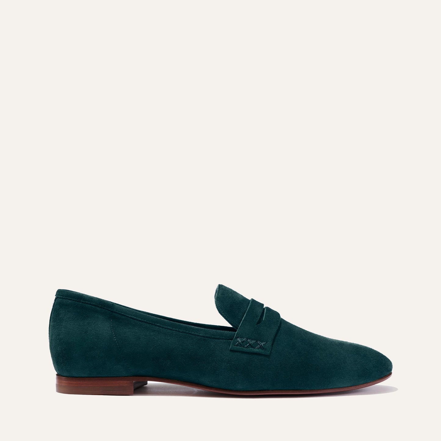 Margaux's classic and comfortable Penny loafer, made in a soft, emerald green Italian suede