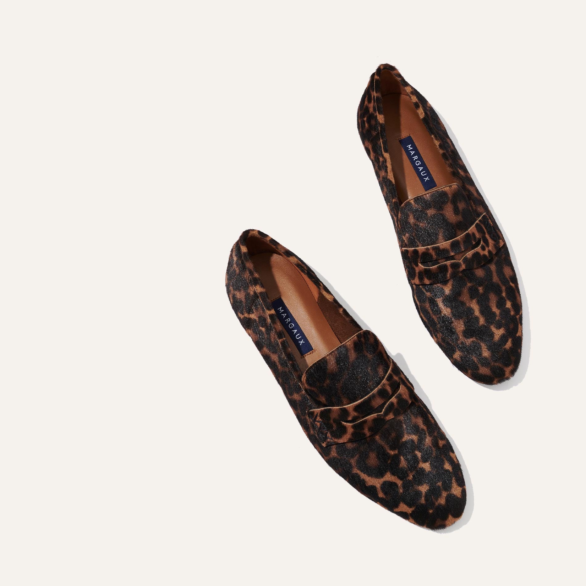 Margaux's classic and comfortable Penny loafer, made in Spain from soft, leopard-print Italian haircalf