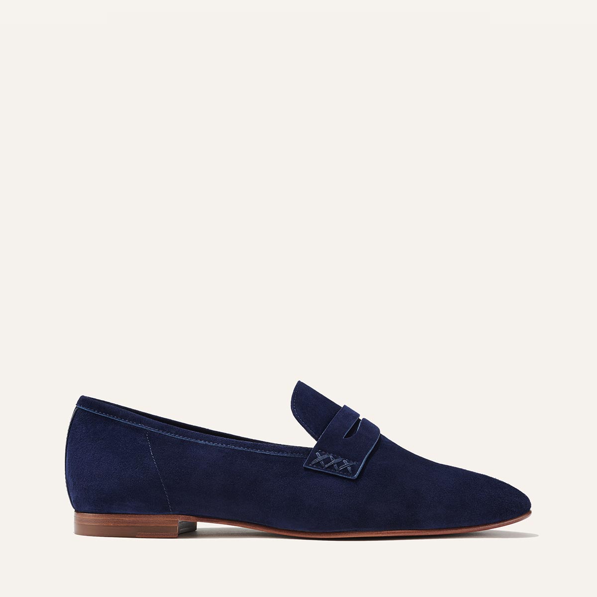 Margaux's classic and comfortable Penny loafer, made in a soft, indigo blue Italian suede