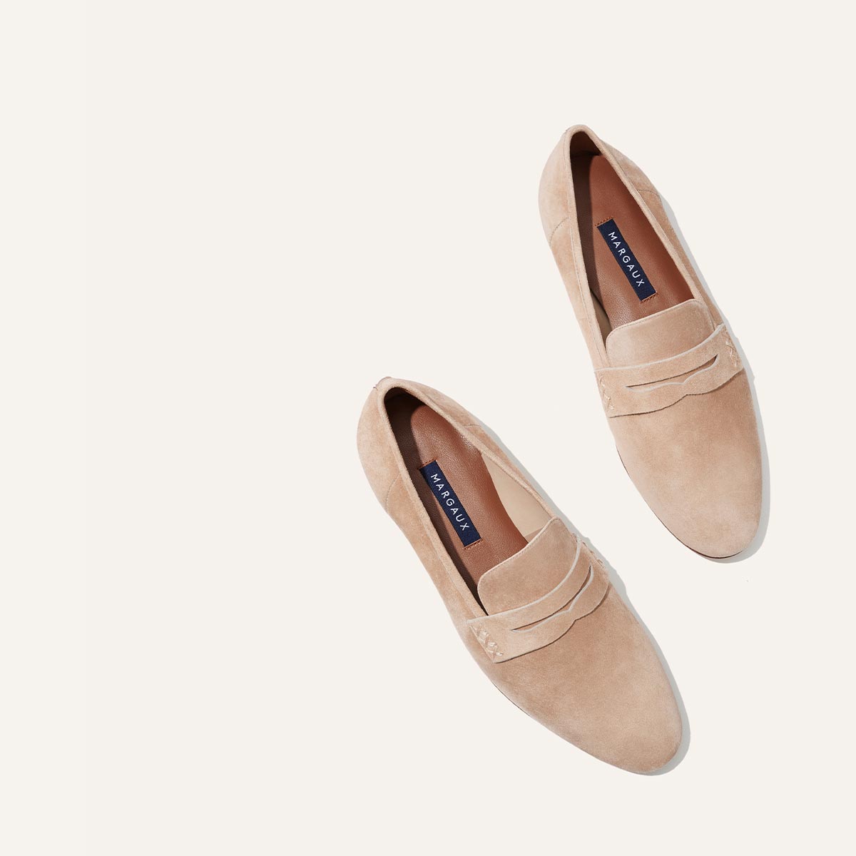Margaux's classic and comfortable Penny loafer, made in Spain from soft, beige Italian suede 