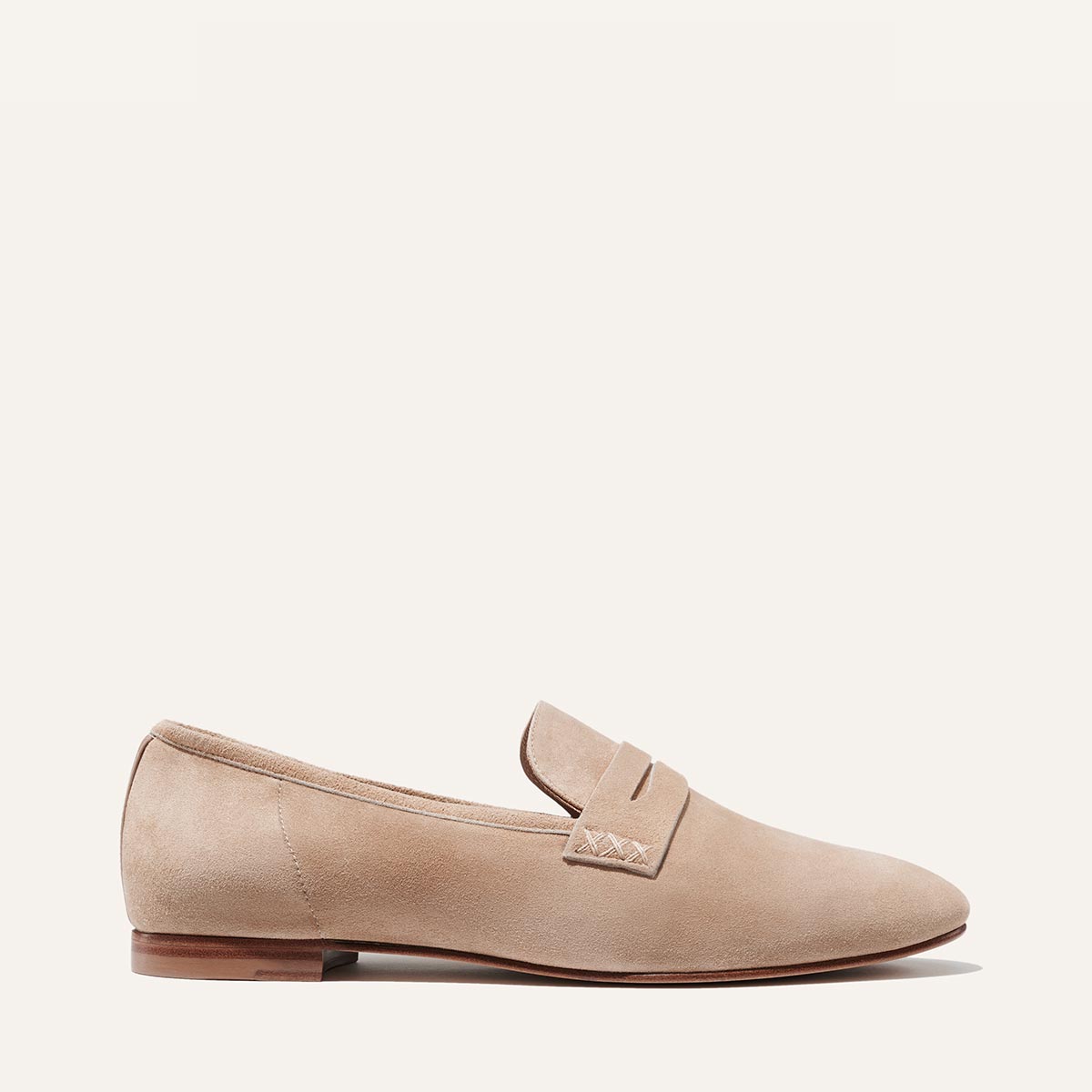 Margaux's classic and comfortable Penny loafer, made in a soft, neutral Italian suede
